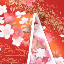 Tissu japonais - Fleurs de cerisier fond orange